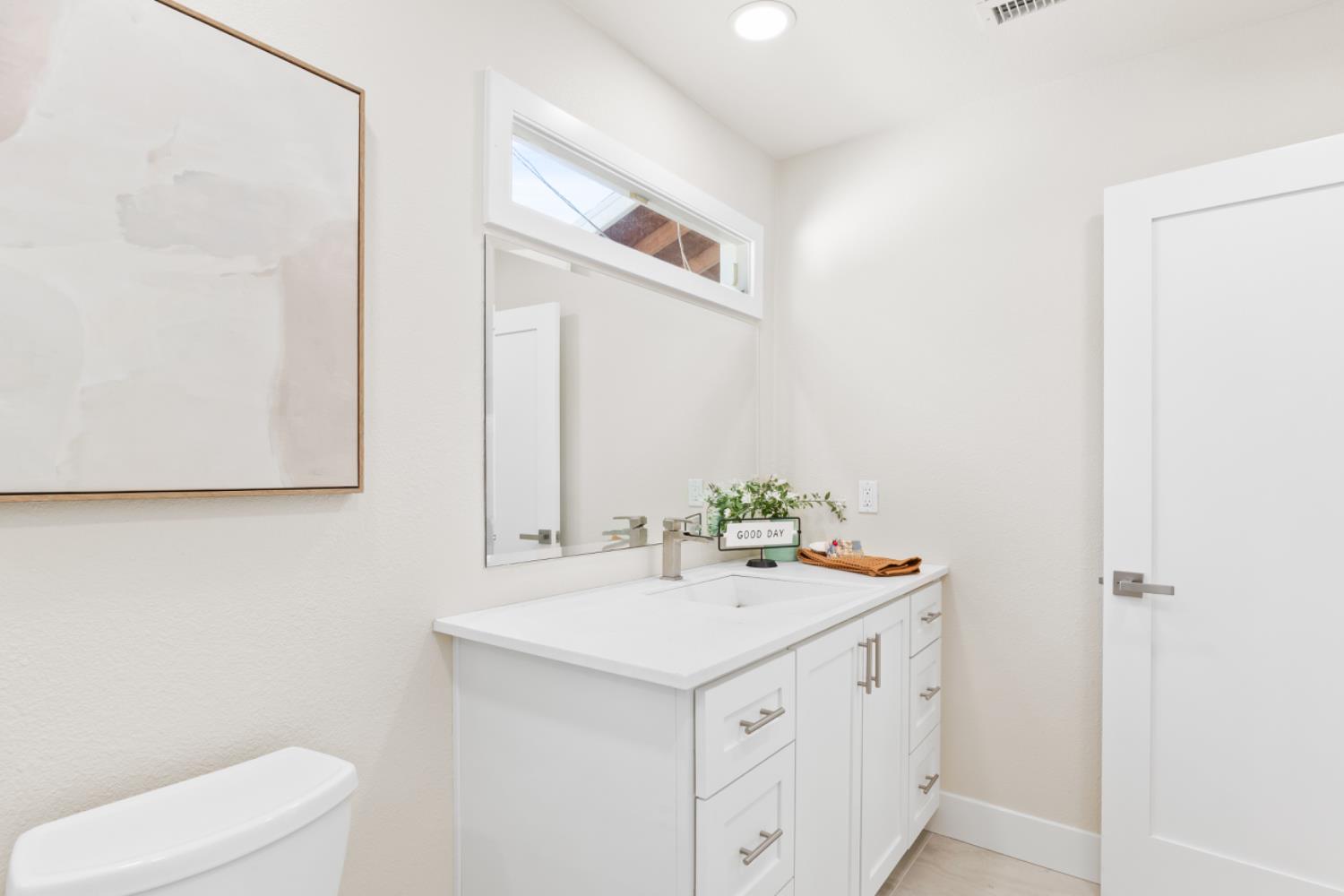 2495 Meadow Creek Road Lincoln, CA 95648 - Photo 32 of 94 a bathroom with a sink and a mirror
