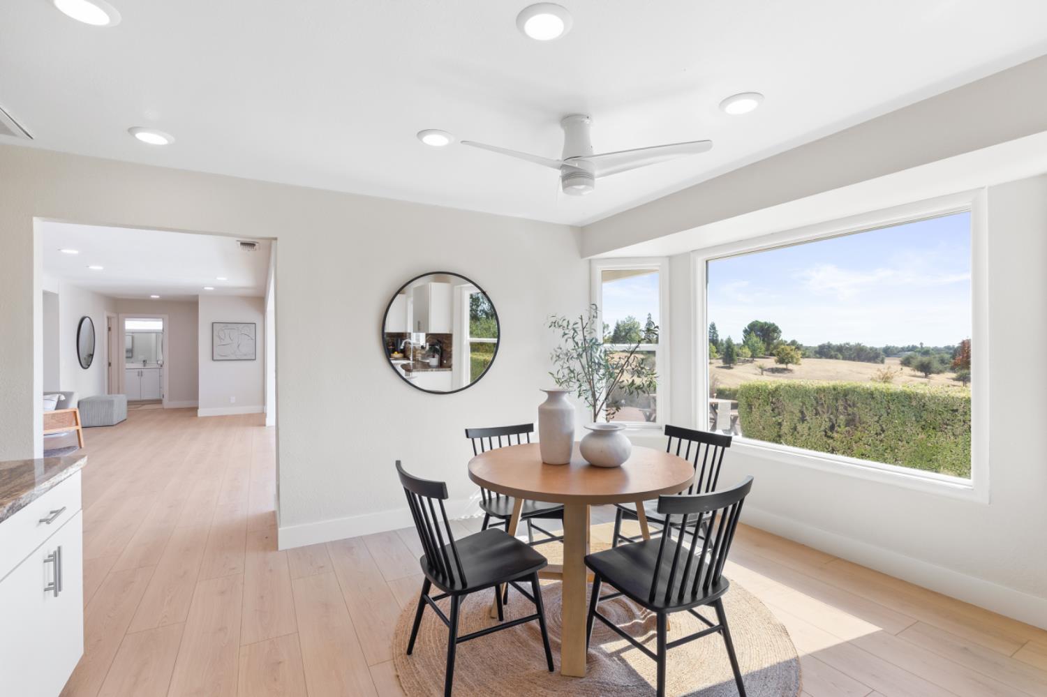 2495 Meadow Creek Road Lincoln, CA 95648 - Photo 35 of 94 a dining room with furniture window and wooden floor