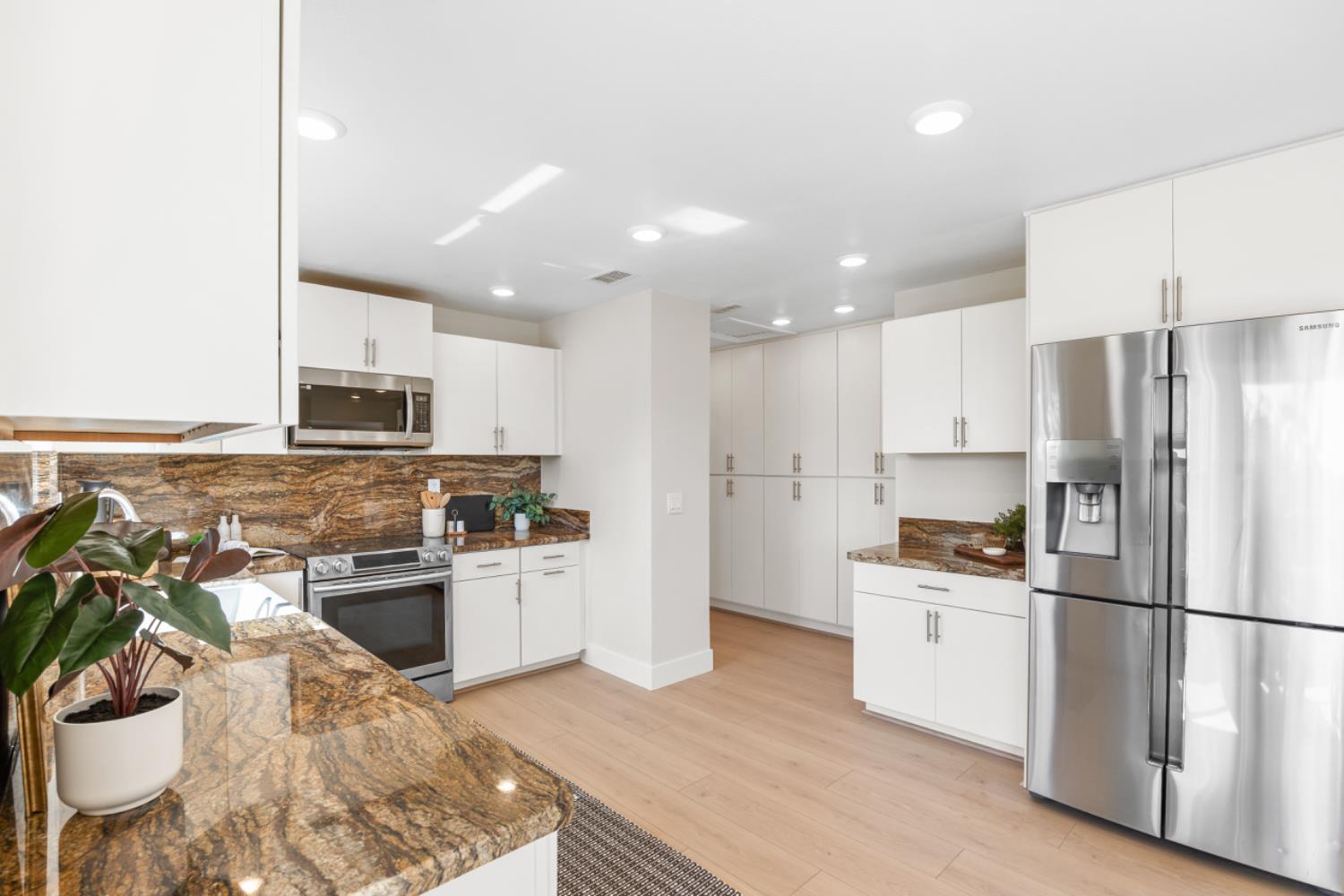 2495 Meadow Creek Road Lincoln, CA 95648 - Photo 37 of 94 a kitchen with stainless steel appliances granite countertop a refrigerator sink stove microwave and cabinets
