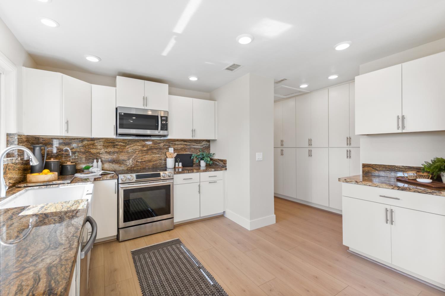 2495 Meadow Creek Road Lincoln, CA 95648 - Photo 38 of 94 a kitchen with stainless steel appliances granite countertop a refrigerator a stove top oven a sink and cabinets