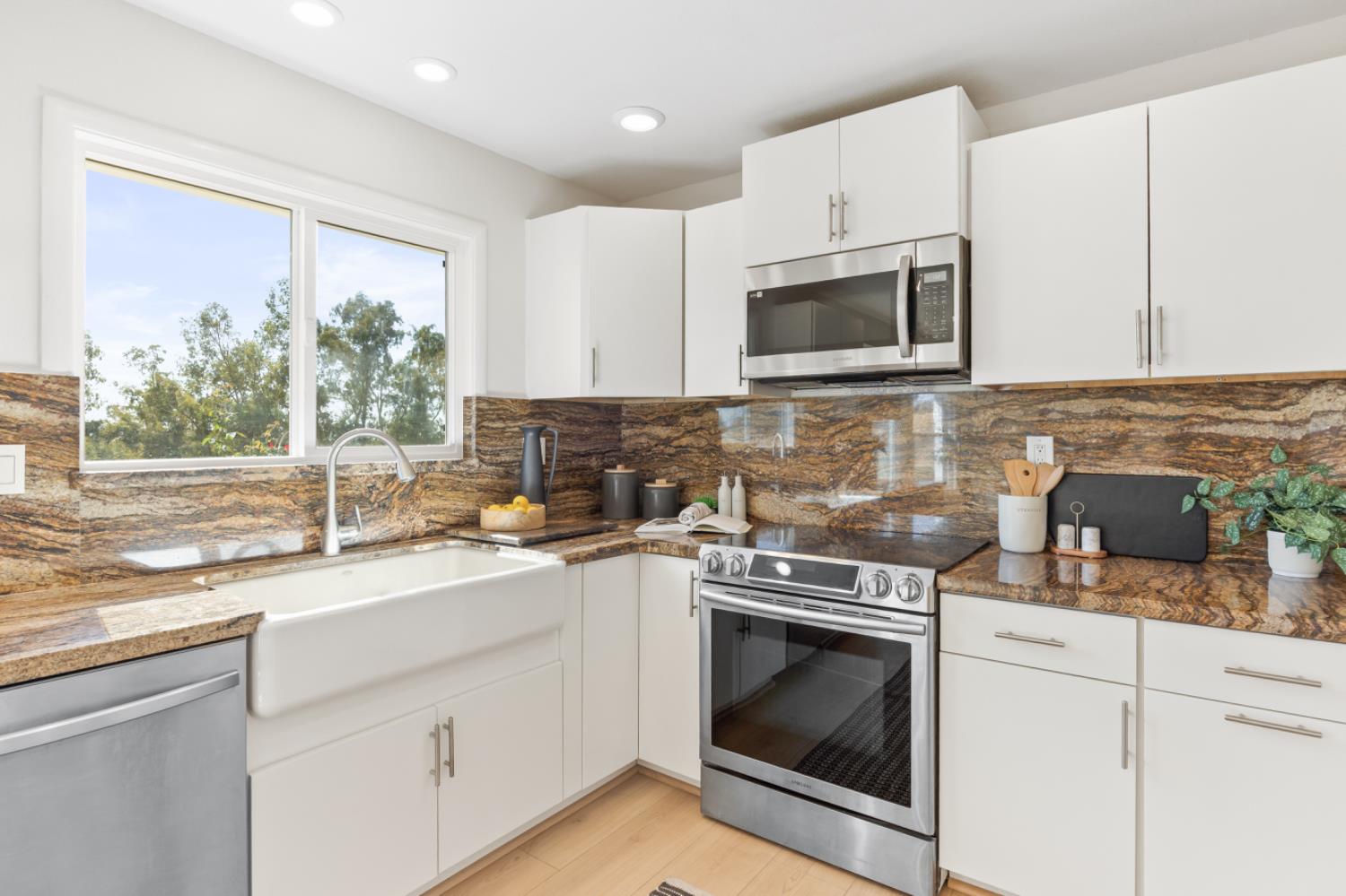 2495 Meadow Creek Road Lincoln, CA 95648 - Photo 39 of 94 a kitchen with cabinets stainless steel appliances a sink and a window