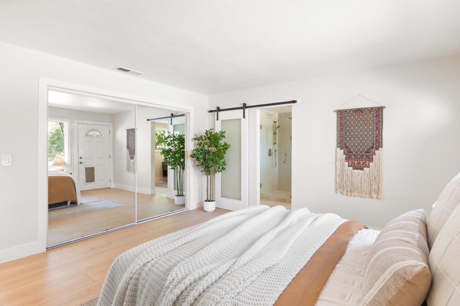 2495 Meadow Creek Road Lincoln, CA 95648 - Photo 45 of 94 a bedroom with a bed and a large mirror