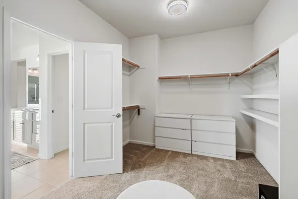 a bedroom with bed and a window