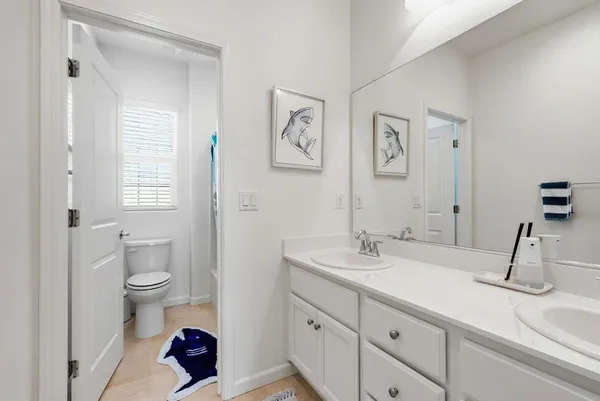 a utility room with sink dryer and washer