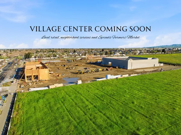 an aerial view of a residential building and lake view