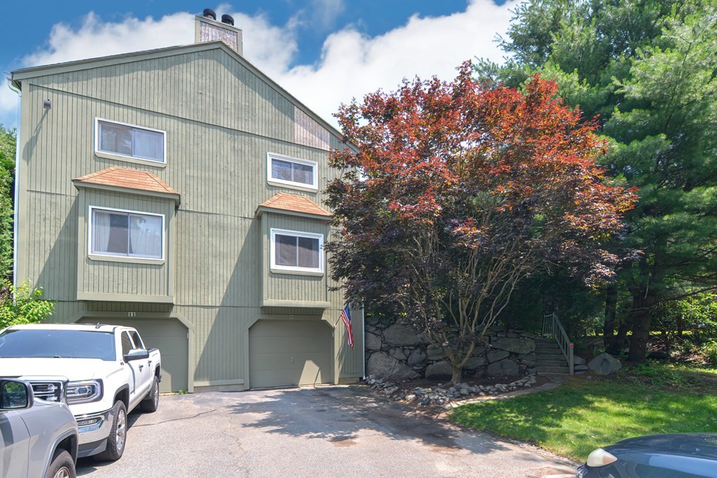9 Crown's Way, Unit 9 Uxbridge, MA 01569 - Photo 1 of 40 a front view of a house with a yard
