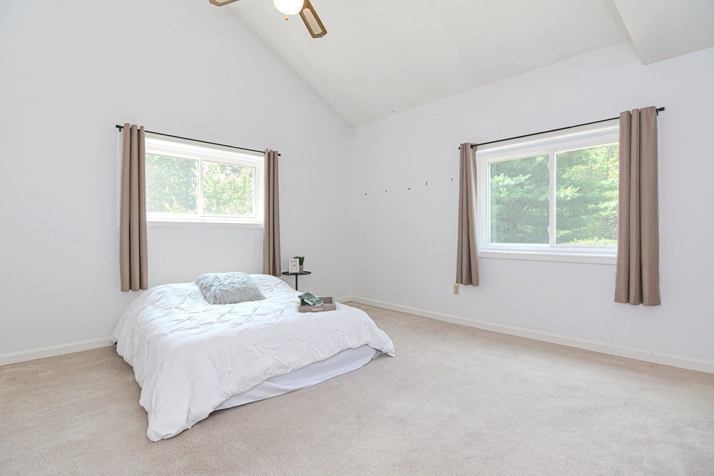 9 Crown's Way, Unit 9 Uxbridge, MA 01569 - Photo 21 of 40 a bedroom with a bed and a window