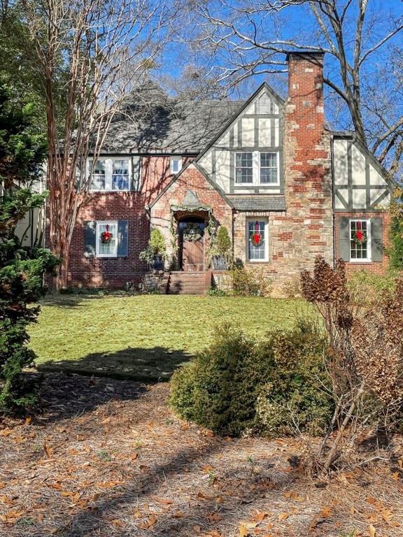 100 Palisades Road Northeast Atlanta, GA 30309 - Photo 1 of 1 a front view of house with yard