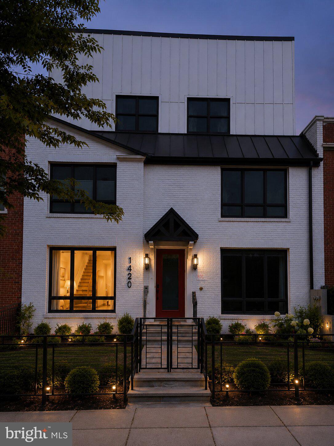 1420 Staples Street Northeast, Unit 1 Washington, DC 20002 - Photo 22 of 22 a front view of a house with garage