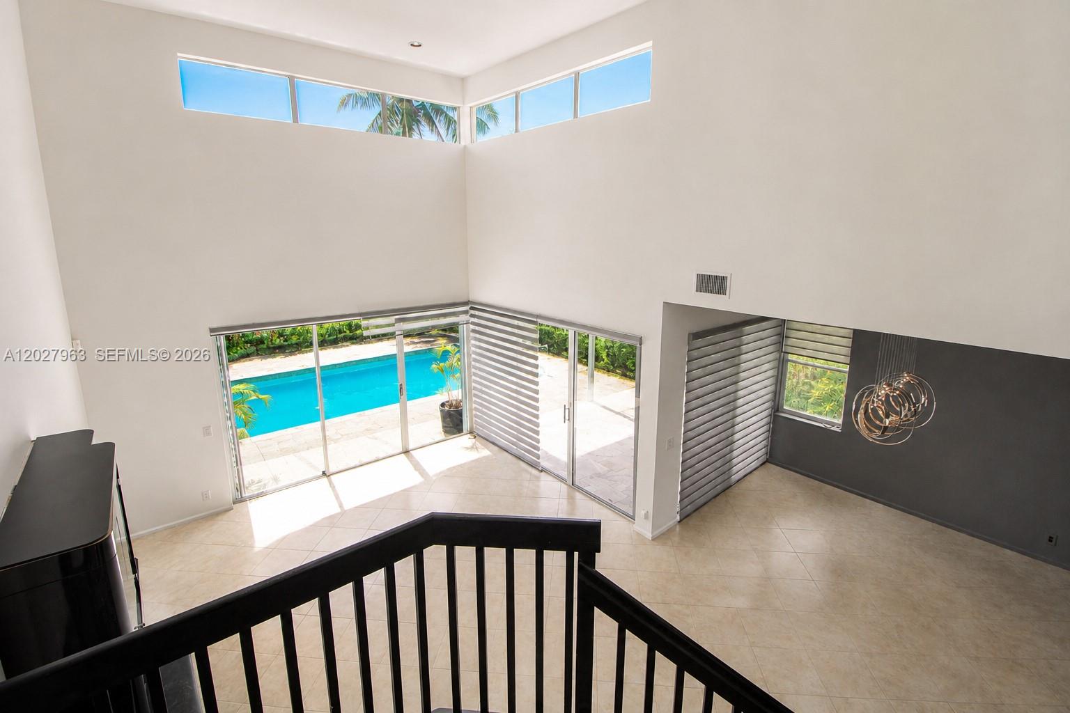 6646 Northwest 25th Terrace Boca Raton, FL 33496 - Photo 6 of 48 a view of an empty room and window