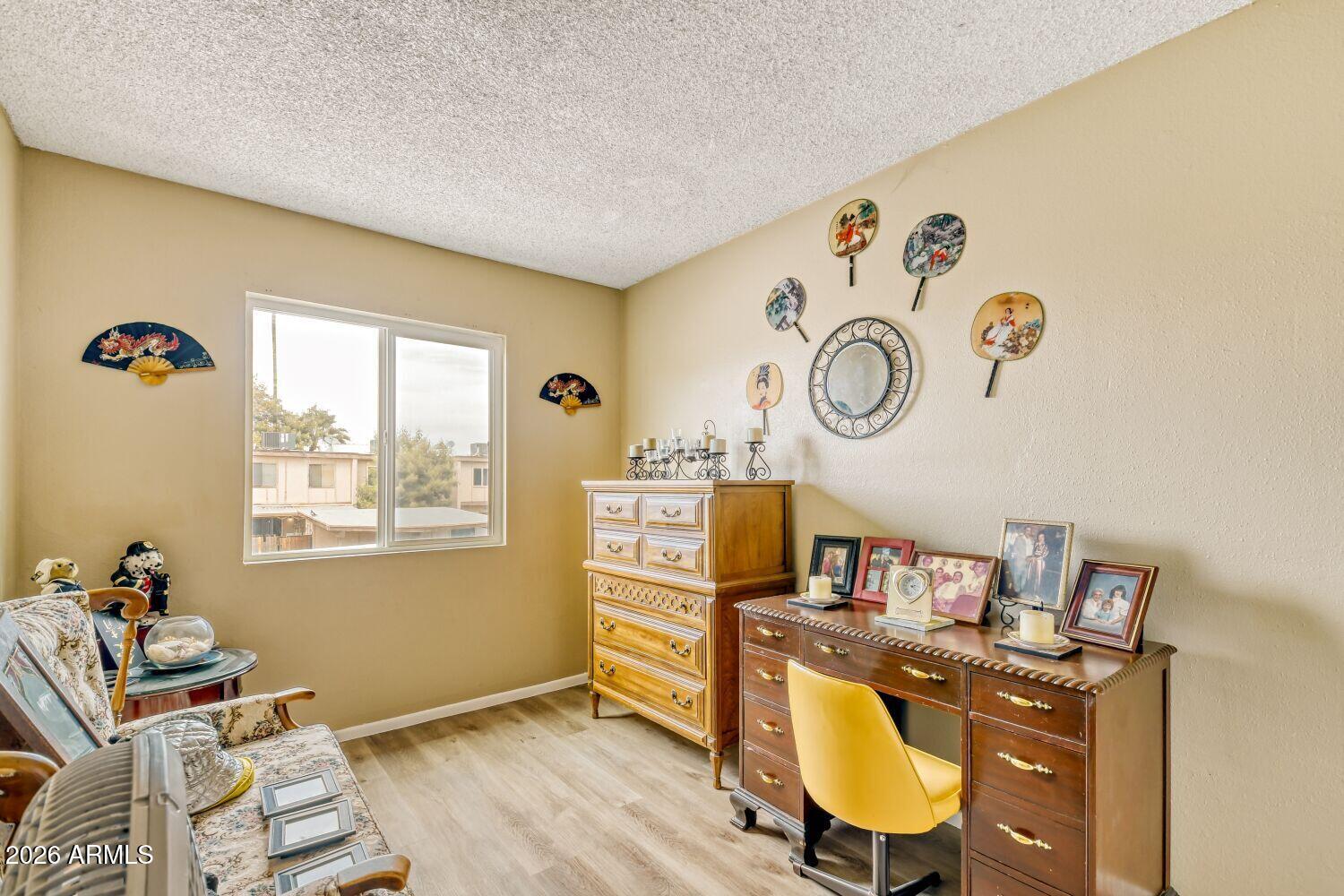 4625 West Thomas Road, Unit 39 Phoenix, AZ 85031 - Photo 24 of 27 a workspace with furniture and window