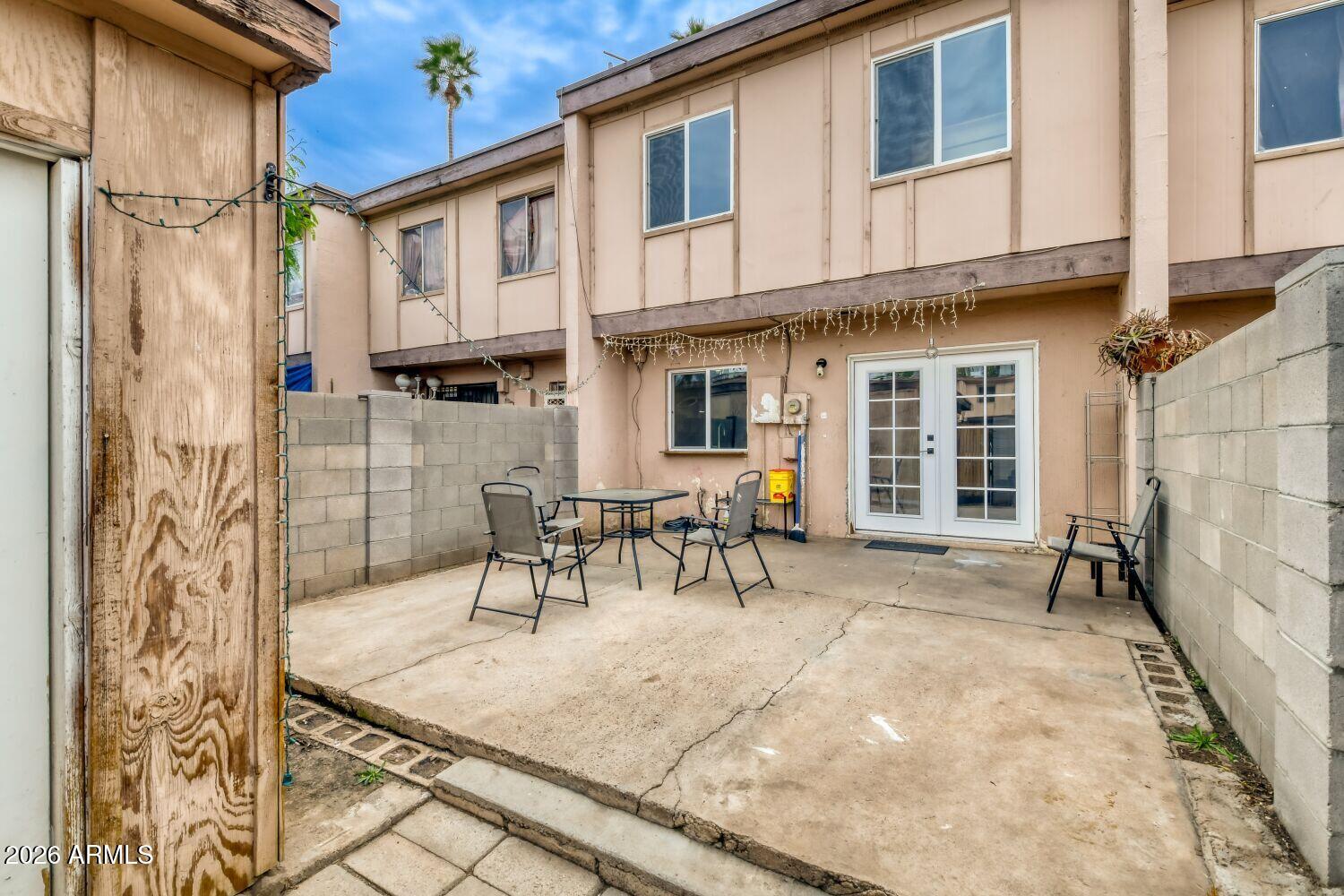 4625 West Thomas Road, Unit 39 Phoenix, AZ 85031 - Photo 26 of 27 a view of a house with backyard and sitting area