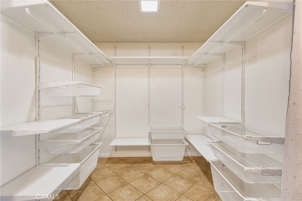 24321 Barley Road Moreno Valley, CA 92557 - Photo 27 of 66 a bathroom with a bathtub and a shower