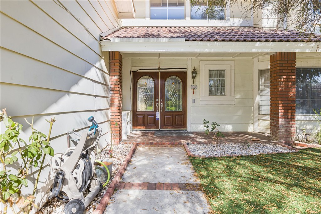 24321 Barley Road Moreno Valley, CA 92557 - Photo 4 of 66 a front view of a house with a yard