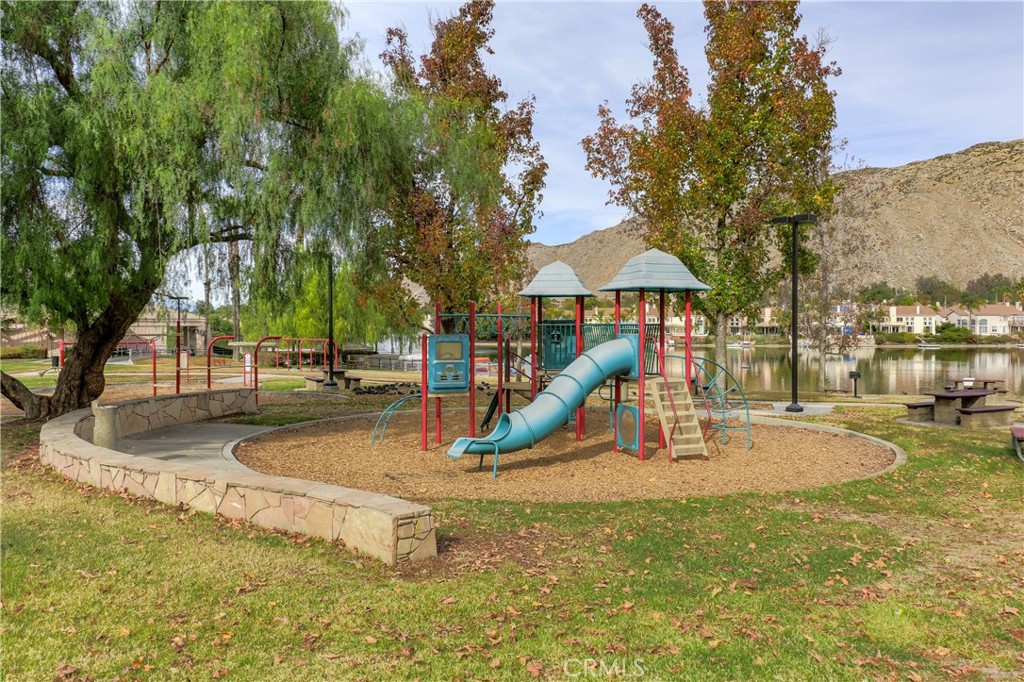 24321 Barley Road Moreno Valley, CA 92557 - Photo 57 of 66 a view of a park with swings and slides
