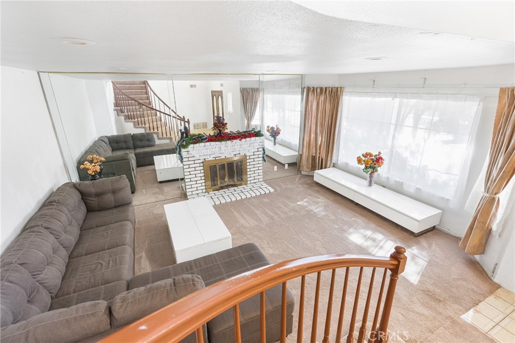 24321 Barley Road Moreno Valley, CA 92557 - Photo 8 of 66 a living room with furniture and a large window