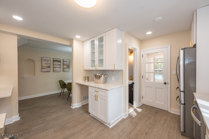211 Conway Court South Orange, NJ 07079 - Photo 11 of 26 a view of kitchen with refrigerator stove and wooden floor