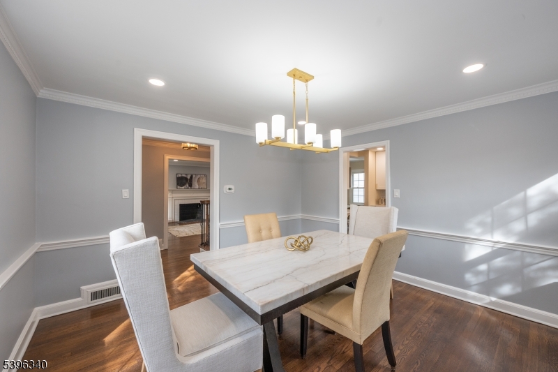 211 Conway Court South Orange, NJ 07079 - Photo 15 of 26 a view of a dining room with furniture a chandelier and wooden floor