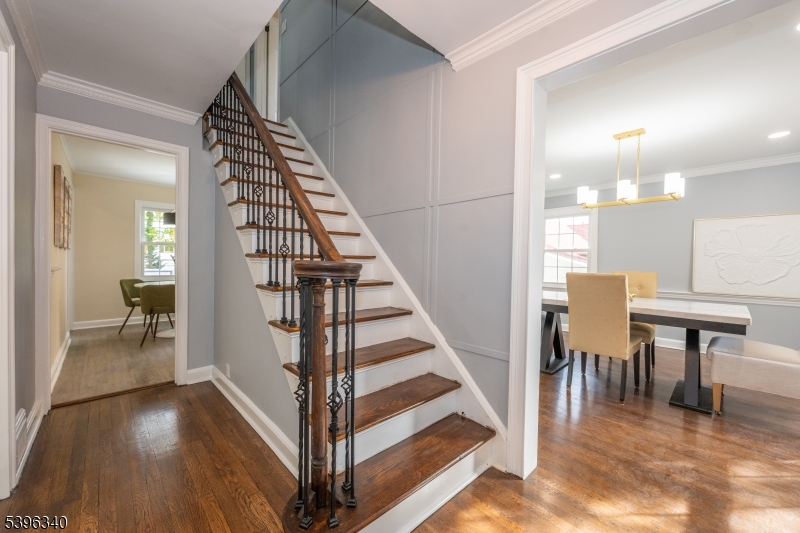 211 Conway Court South Orange, NJ 07079 - Photo 17 of 26 a view of a hallway with wooden floor and staircase