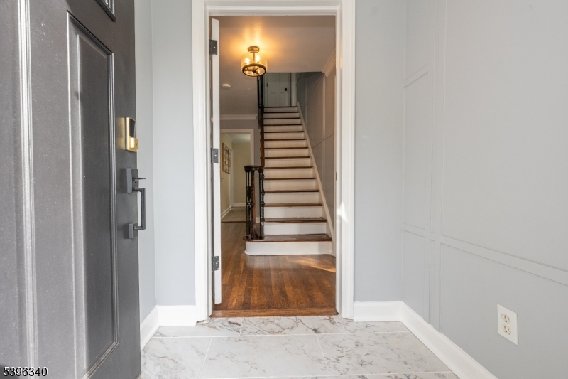 211 Conway Court South Orange, NJ 07079 - Photo 5 of 26 a view of a hallway with a outdoor space and mirror