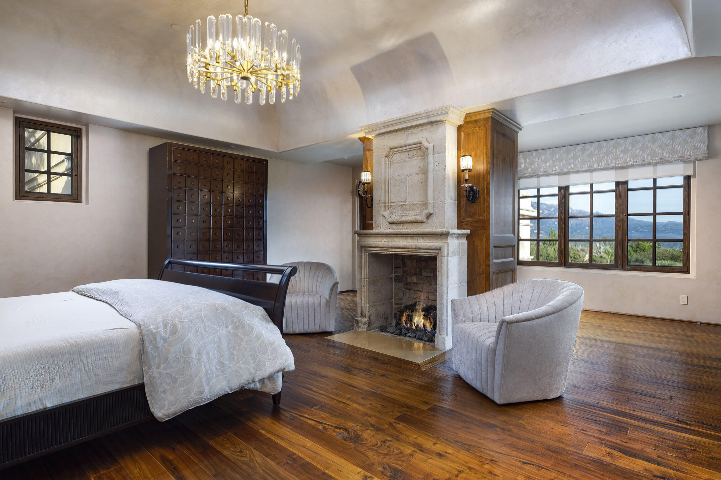 2692 Sycamore Canyon Road Montecito, CA 93108 - Photo 12 of 24 a bedroom with a bed and a fireplace
