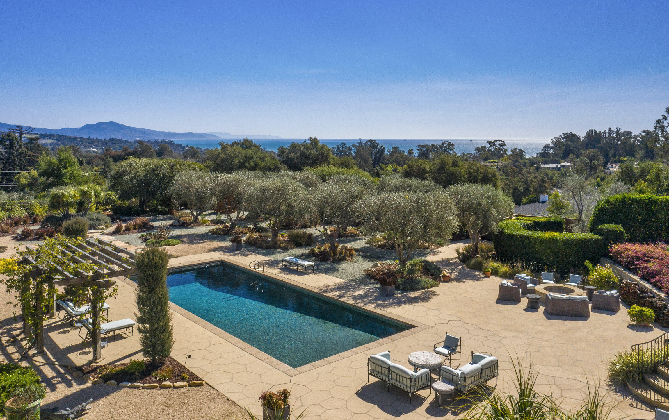 2692 Sycamore Canyon Road Montecito, CA 93108 - Photo 2 of 24 a view of a swimming pool and lounge chairs