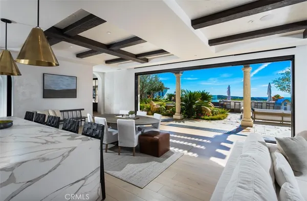 a view of a livingroom with furniture and a flat screen tv