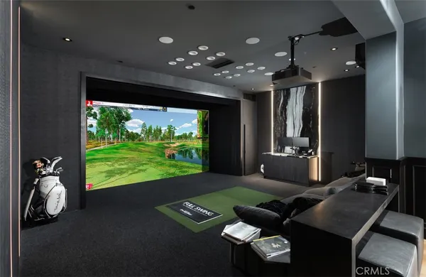 a spacious bedroom with a balcony a bed and a chandelier
