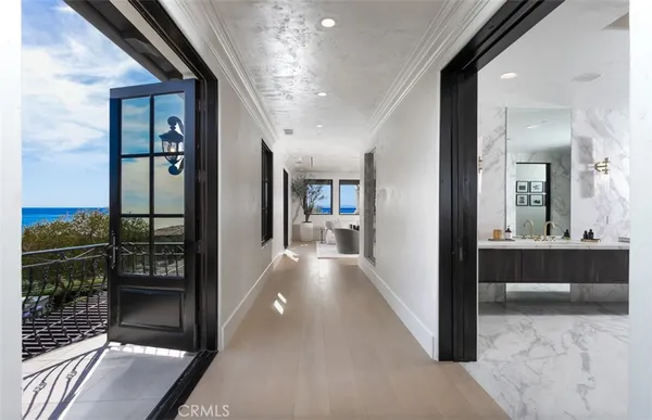 a spacious bathroom with a granite countertop sink a mirror and a bathtub