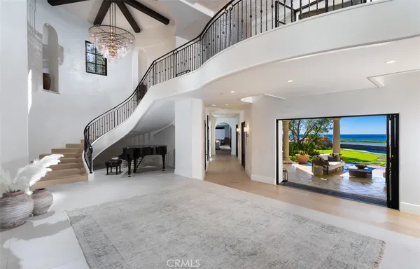 a living room with lots of furniture and large windows
