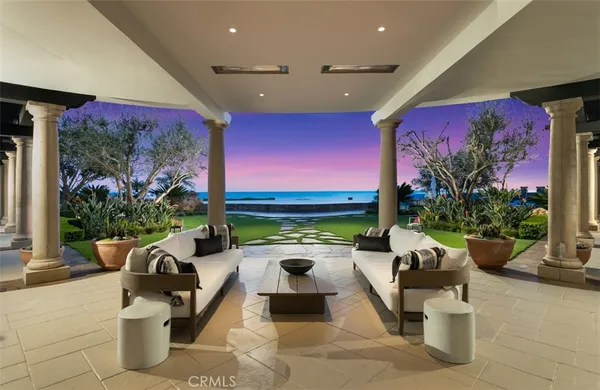 a kitchen with stainless steel appliances granite countertop a sink a stove and a wooden floor
