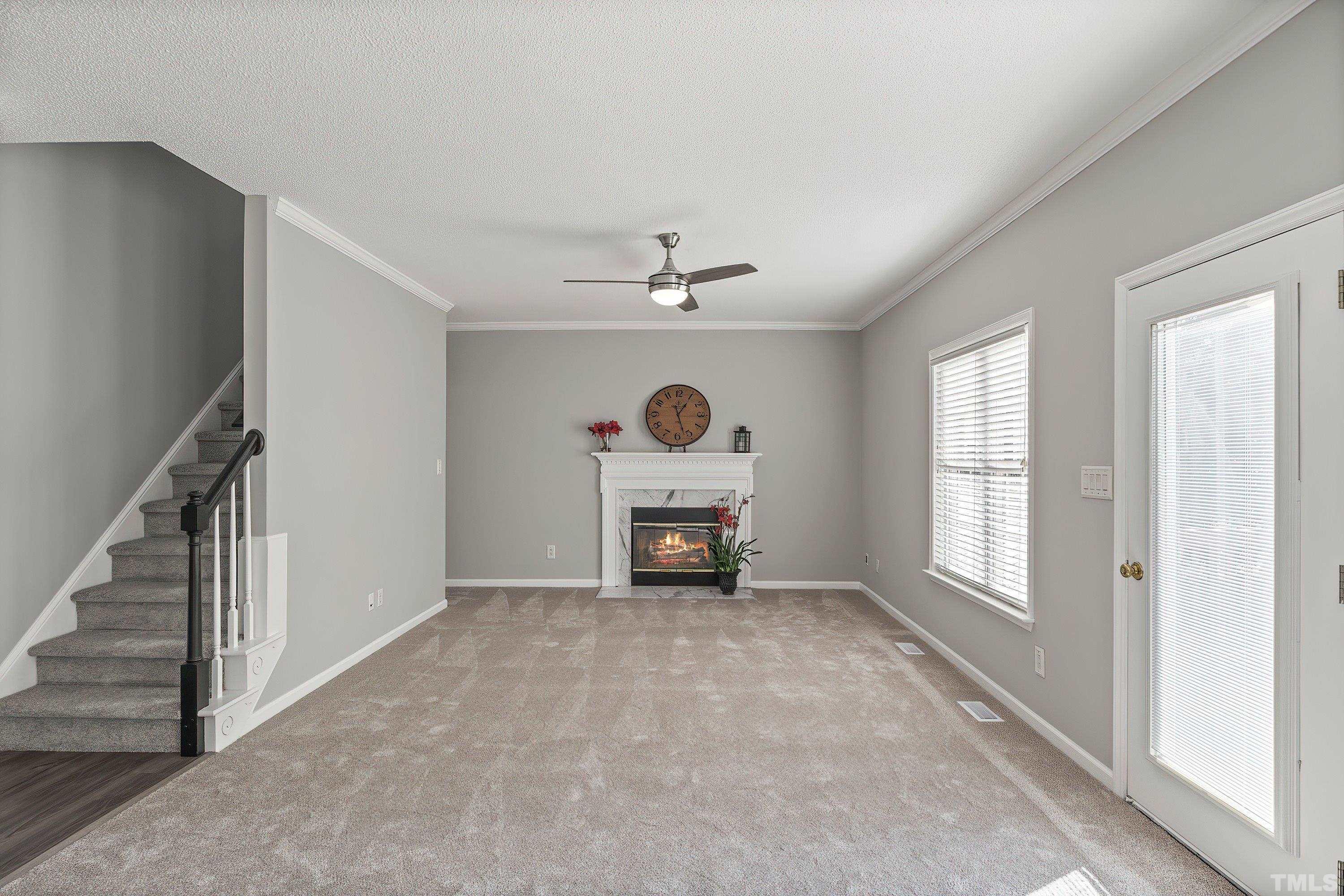 1008 Linden Crest Road Raleigh, NC 27603 - Photo 15 of 37 an empty room with windows and fireplace