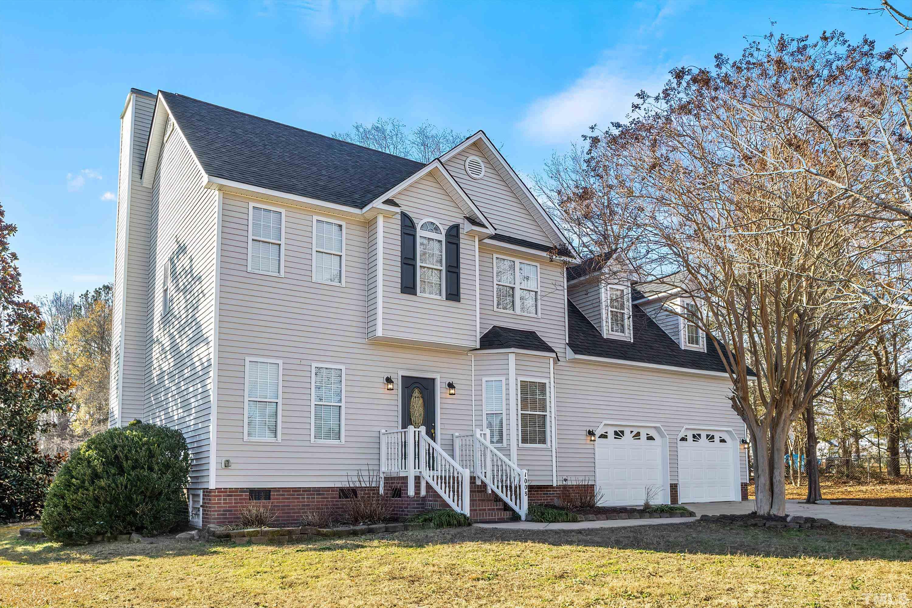 1008 Linden Crest Road Raleigh, NC 27603 - Photo 36 of 37 a front view of a house with a yard