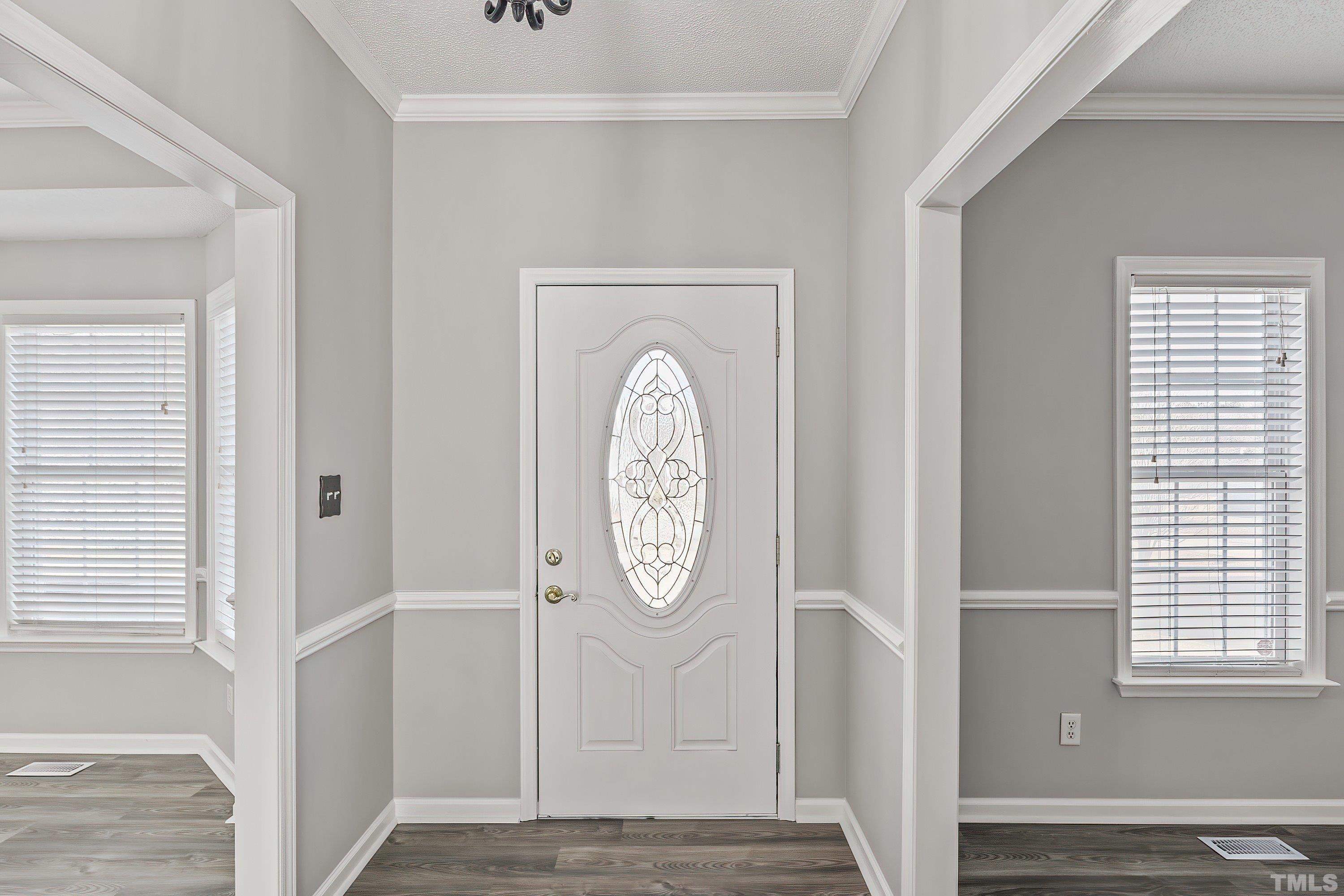 1008 Linden Crest Road Raleigh, NC 27603 - Photo 5 of 37 a view of entryway with wooden floor
