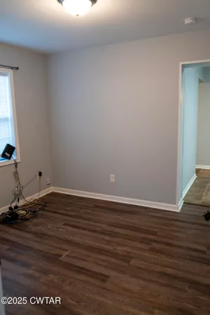 a view of a room with wooden floor and closet