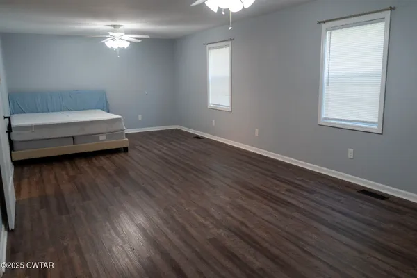 a bathroom with a sink window and a mirror