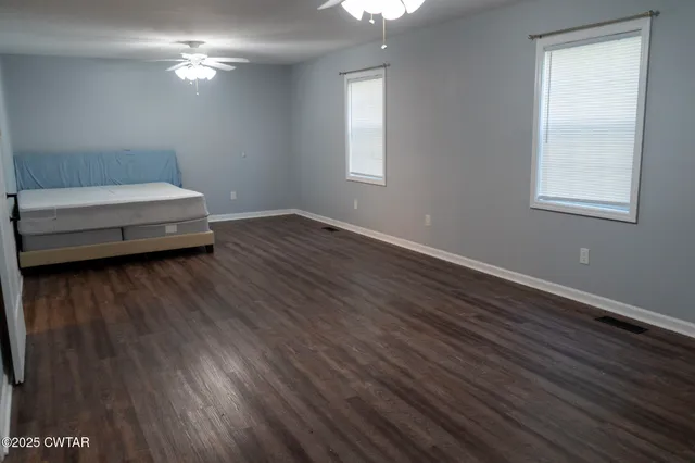 a bathroom with a sink window and a mirror