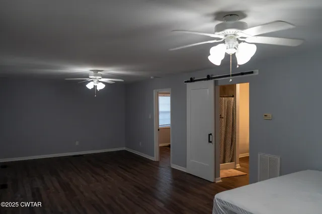 a view of a livingroom with a chandelier fan