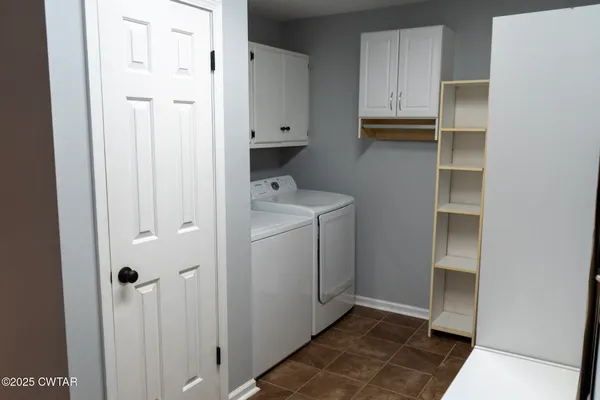 a utility room with cabinets