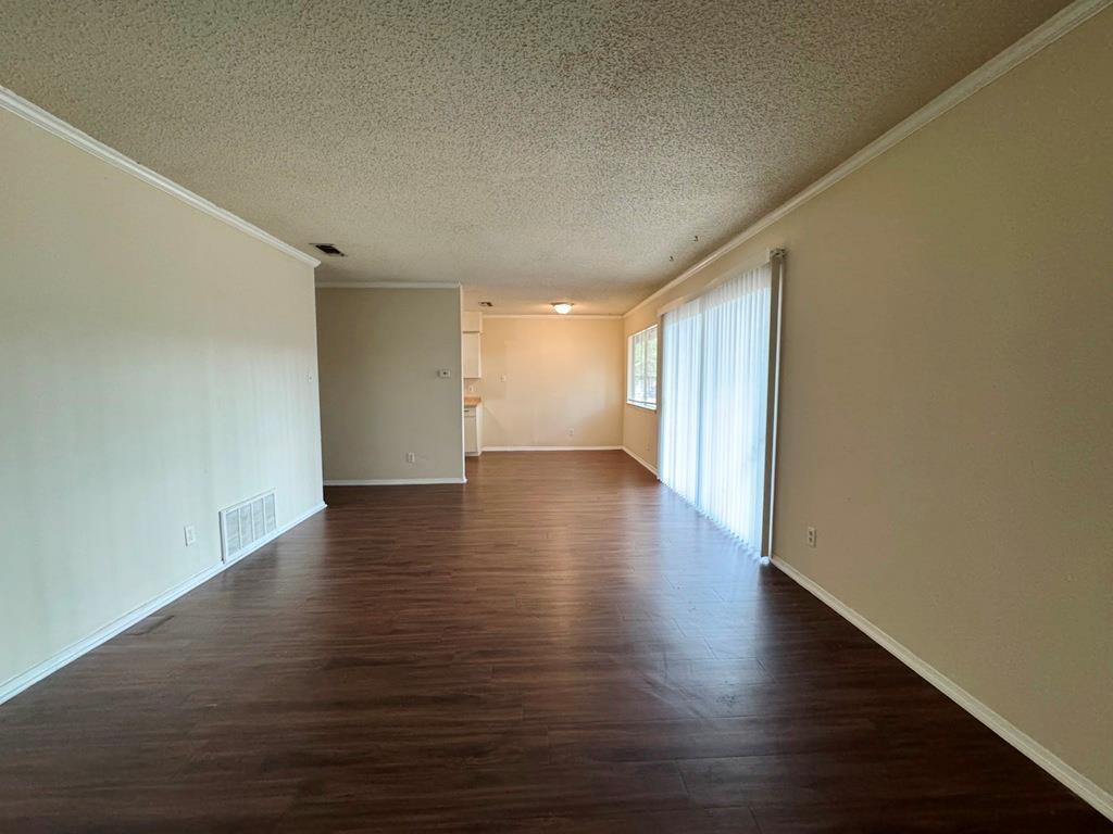 5905 Burrough Drive Austin, TX 78745 - Photo 11 of 40 a view of a room with wooden floor