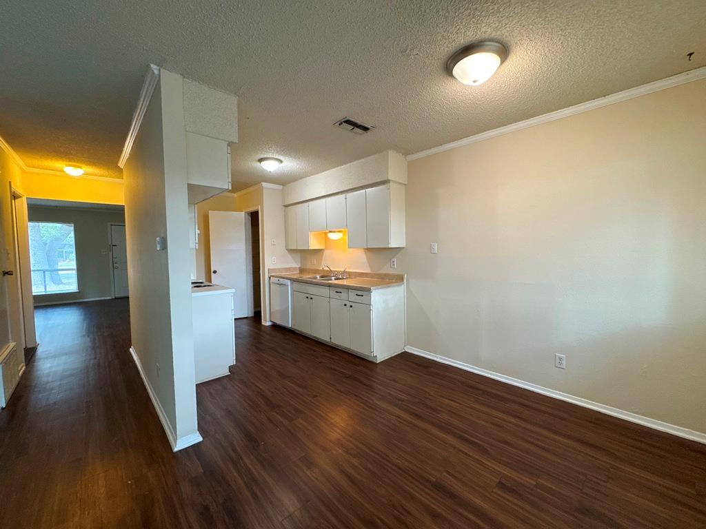 5905 Burrough Drive Austin, TX 78745 - Photo 14 of 40 a view of a kitchen with wooden floor and a kitchen