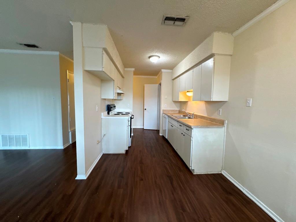 5905 Burrough Drive Austin, TX 78745 - Photo 15 of 40 a kitchen with a hard wood floor