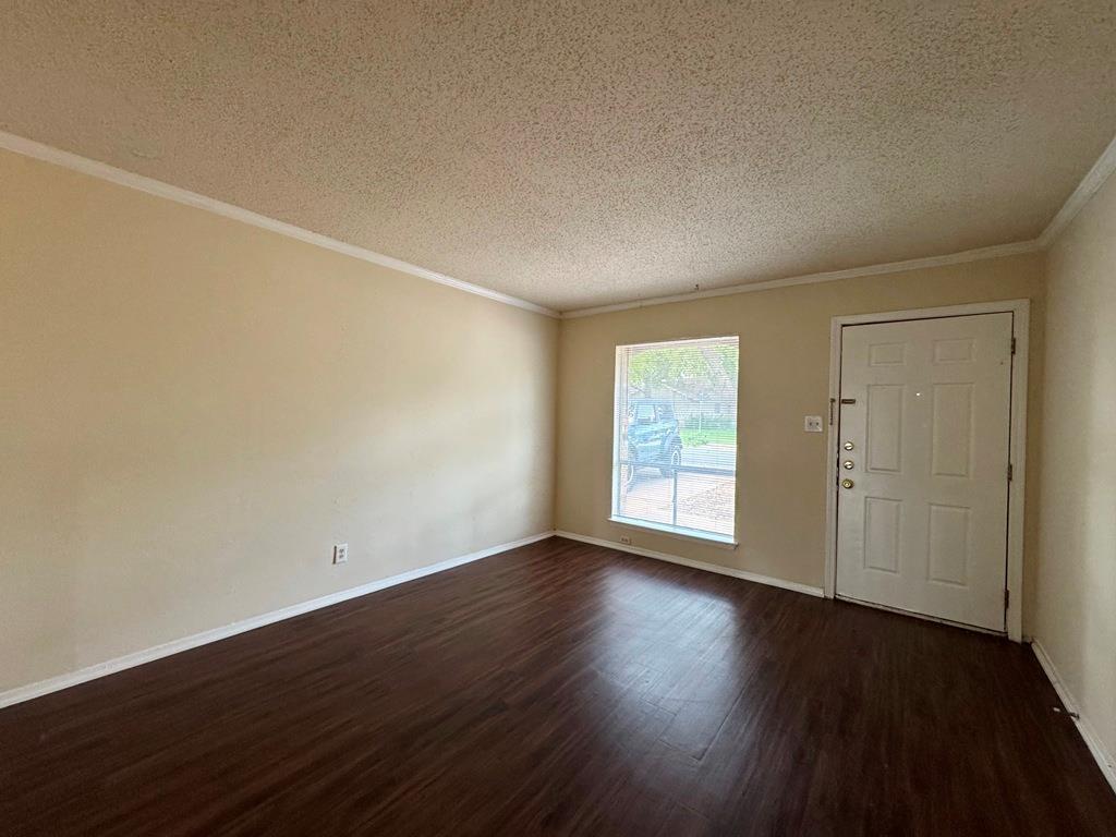 5905 Burrough Drive Austin, TX 78745 - Photo 2 of 40 a view of an empty room with wooden floor and a window