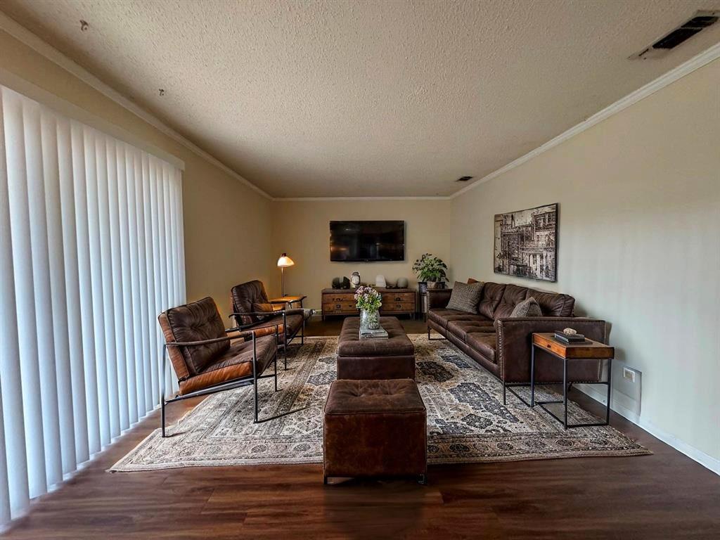 5905 Burrough Drive Austin, TX 78745 - Photo 8 of 40 a living room with furniture hard wood floor and a flat screen tv