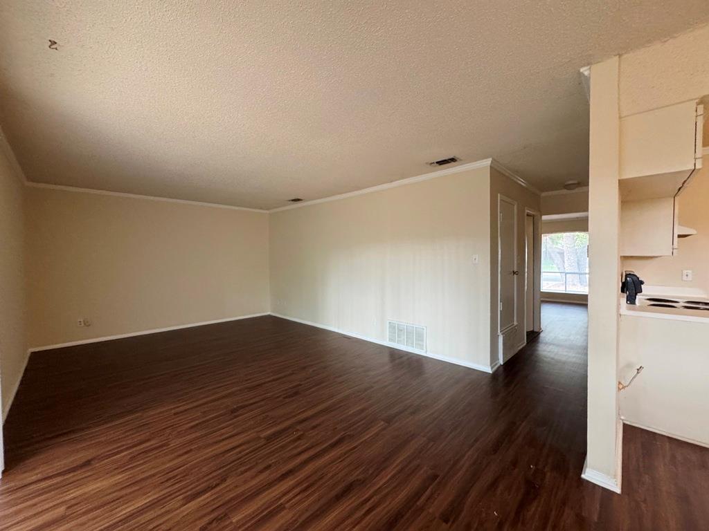 5905 Burrough Drive Austin, TX 78745 - Photo 9 of 40 a view of a hallway with wooden floor
