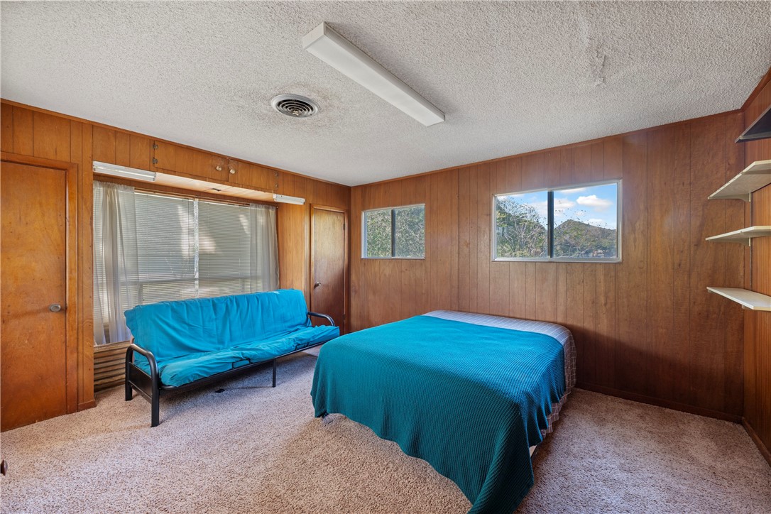 12844 Hearn Road Corpus Christi, TX 78410 - Photo 11 of 34 a bedroom with two beds and a window