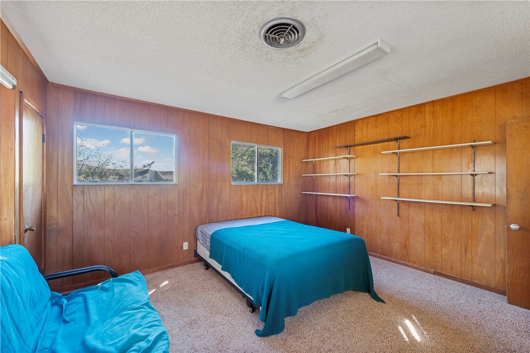 12844 Hearn Road Corpus Christi, TX 78410 - Photo 12 of 34 a bedroom with a bed and a window
