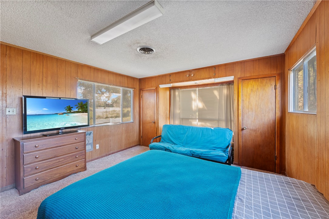 12844 Hearn Road Corpus Christi, TX 78410 - Photo 13 of 34 a bedroom with a bed and wooden floor