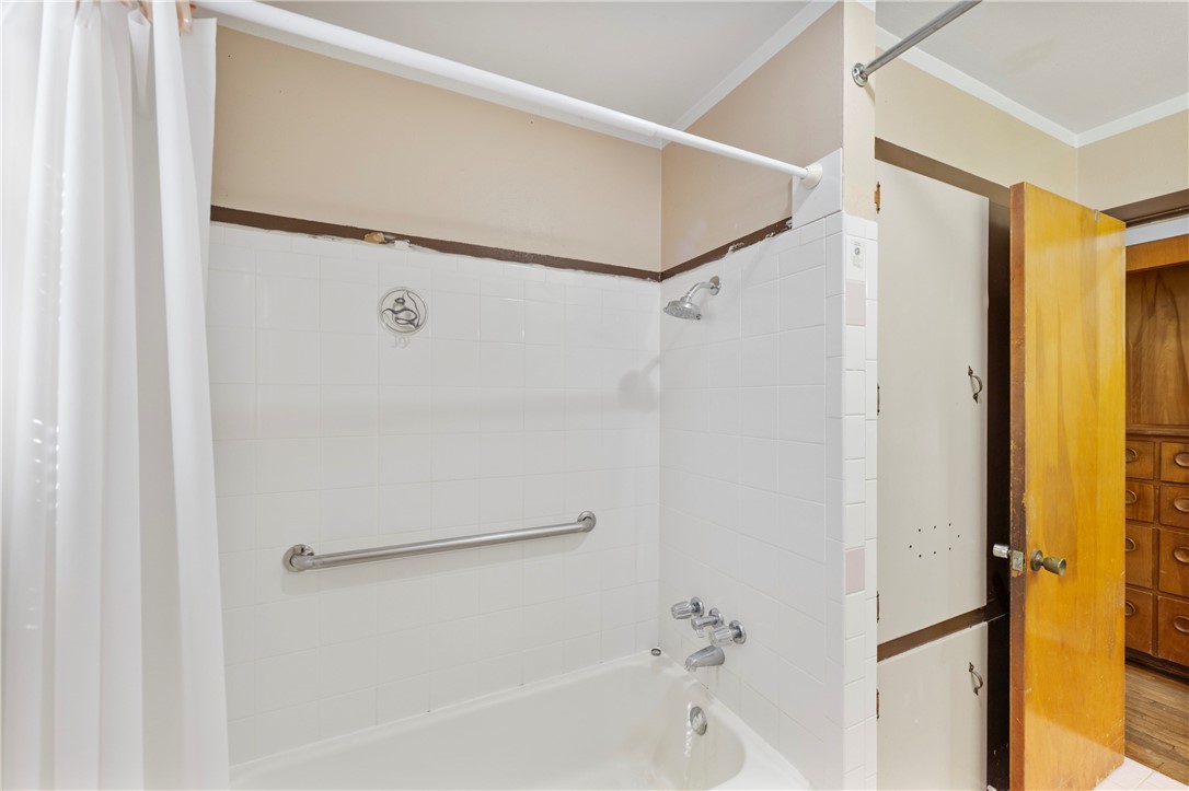 12844 Hearn Road Corpus Christi, TX 78410 - Photo 16 of 34 a bathroom with a bathtub and a shower