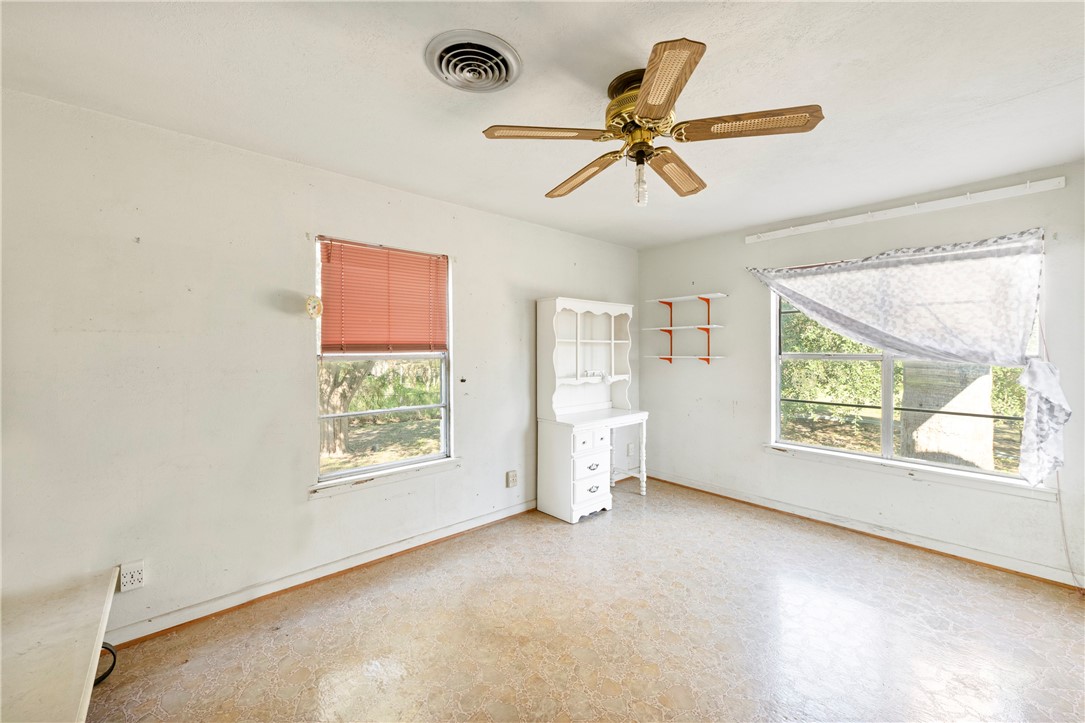 12844 Hearn Road Corpus Christi, TX 78410 - Photo 27 of 34 a view of a livingroom with a ceiling fan and window